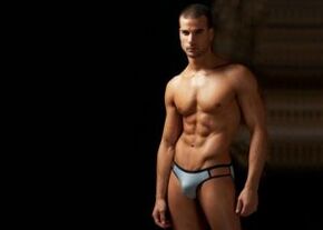 A man in shorts with an enlarged penis